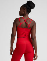 red v-neck cropped tank top with back crossover straps.